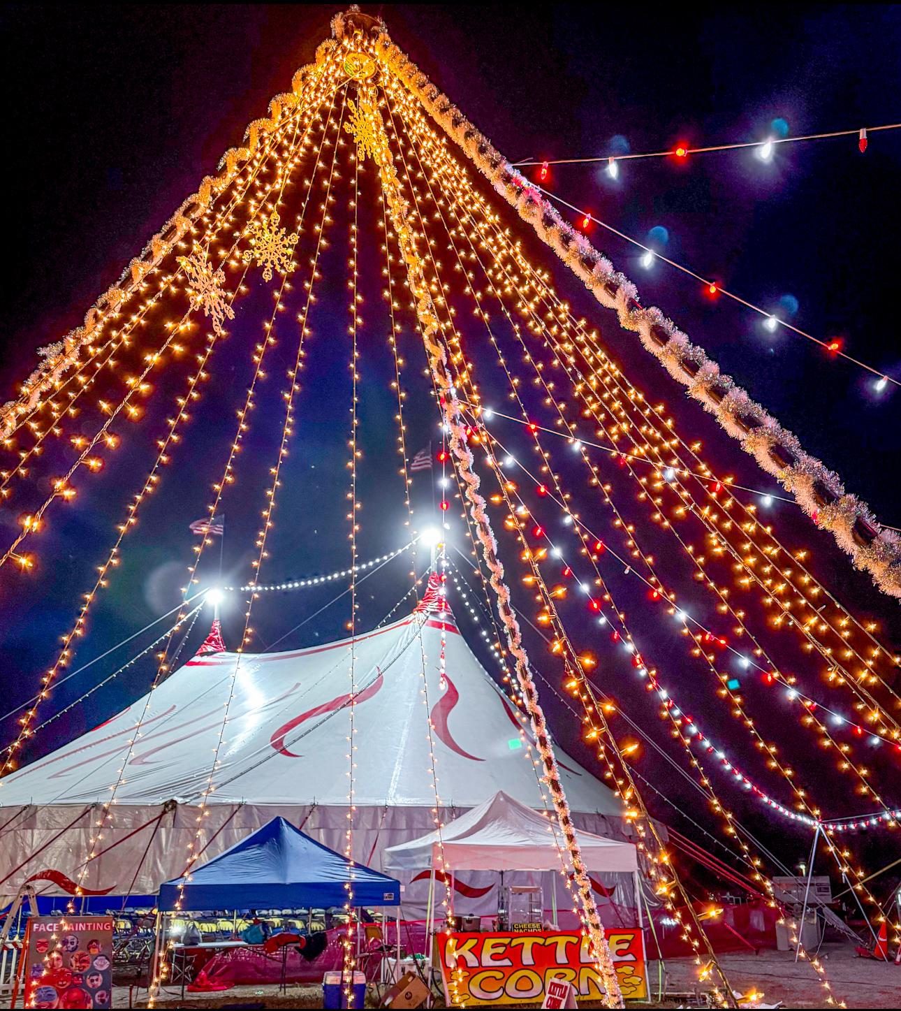 Holiday tent glowing with Christmas lights