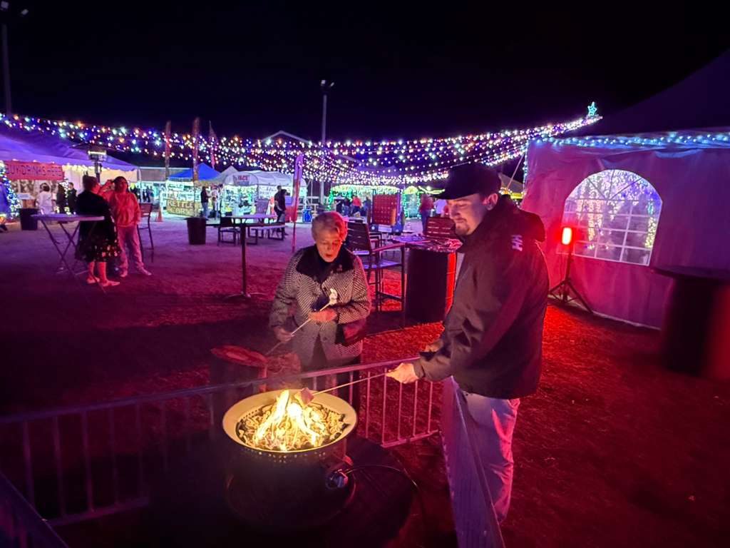 Guests roasting s’mores at a fire pit